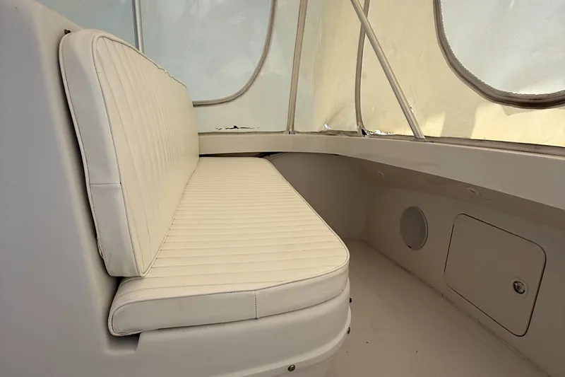 Slide: The Image of Interior seating of 2000 Luhrs Tournament 360 Convertible boat, featuring cushioned bench. - 42