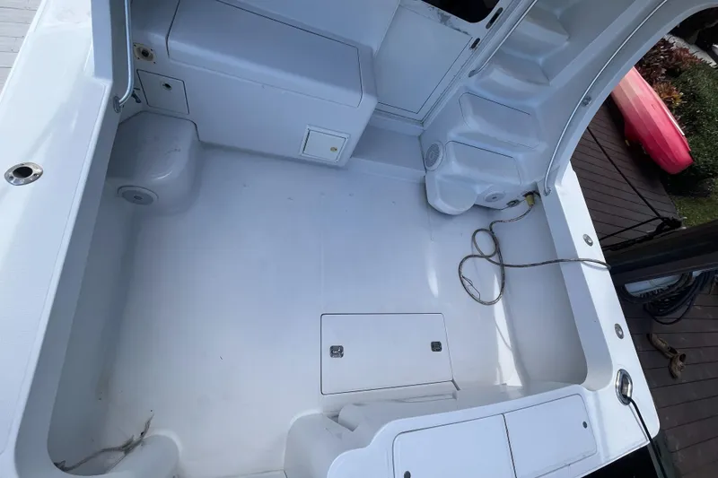 Slide: The Image of Spacious deck of 2000 Luhrs Tournament 360 Convertible boat, featuring storage compartments and clean design. - 44