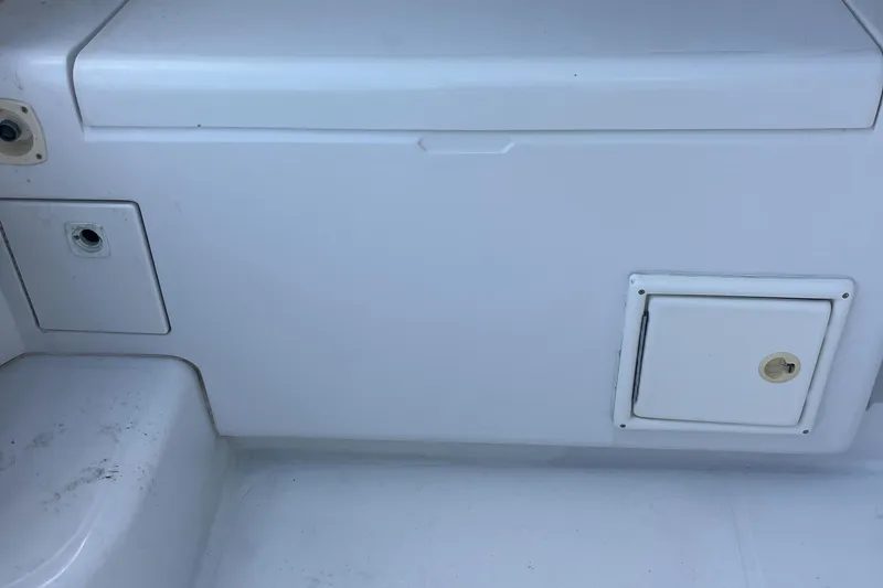 Slide: The Image of 2000 Luhrs Tournament 360 Convertible boat deck with storage compartments. - 46