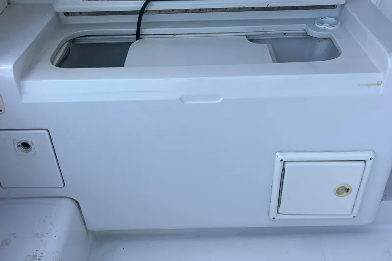 Slide: The Image of 2000 Luhrs Tournament 360 Convertible boat storage compartment and access panel. - 47