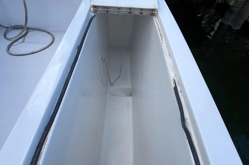 Slide: The Image of Open storage compartment on a 2000 Luhrs Tournament 360 Convertible boat. - 48