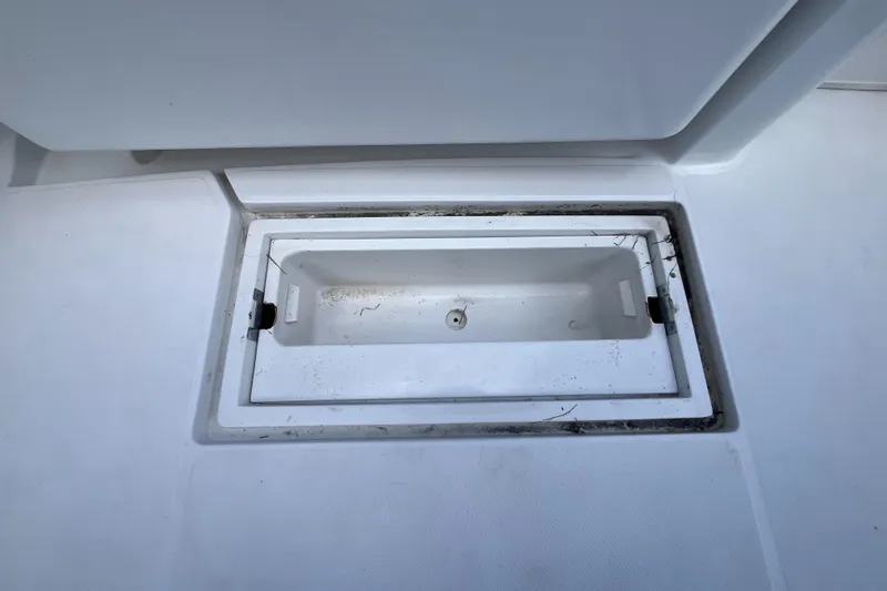 Slide: The Image of Open storage compartment on 2000 Luhrs Tournament 360 Convertible boat deck. - 51