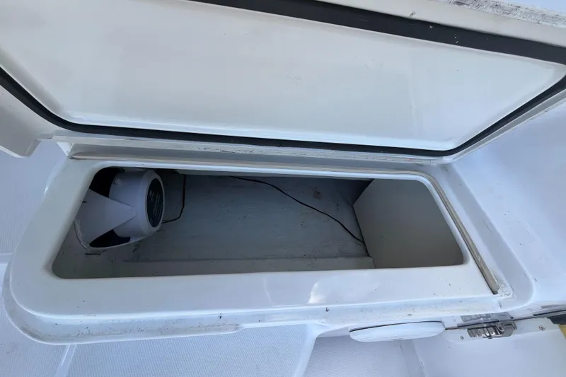 Slide: The Image of Open storage compartment on a 2000 Luhrs Tournament 360 Convertible boat. - 53