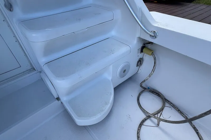 Slide: The Image of Staircase and deck area of 2000 Luhrs Tournament 360 Convertible boat. - 56