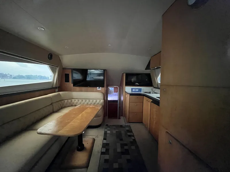 Slide: The Image of Interior of 2000 Luhrs Tournament 360 Convertible yacht with seating and kitchenette. - 59