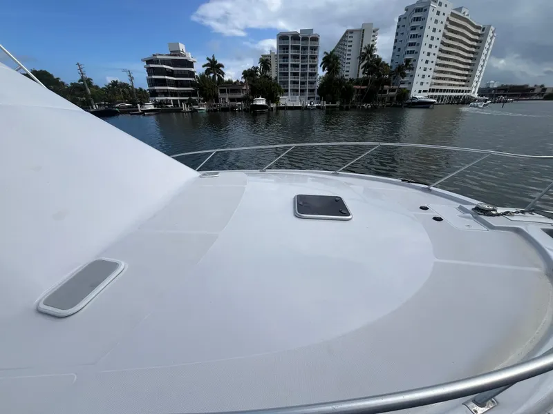 Slide: The Image of Bow view of 2000 Luhrs Tournament 360 Convertible yacht with waterfront buildings in background. - 9
