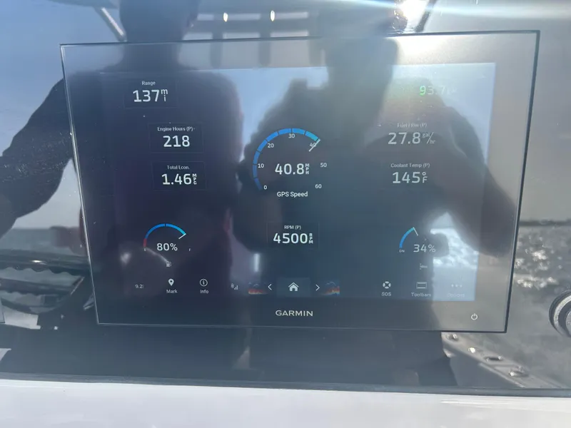 Slide: The Image of Display screen on 2023 Sportsman Masters 267OE Bay Boat showing engine and navigation data. - 10