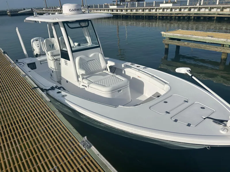 Slide: The Image of 2023 Sportsman Masters 267OE Bay Boat docked, featuring sleek design and modern amenities. - 12