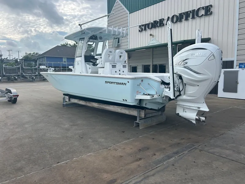 Slide: The Image of 2023 Sportsman Masters 267OE Bay Boat with Yamaha engine outside store. - 16