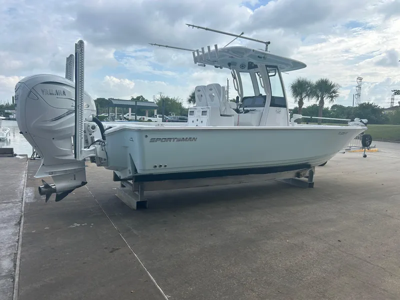 Slide: The Image of 2023 Sportsman Masters 267OE Bay Boat with Yamaha engine on dock. - 19