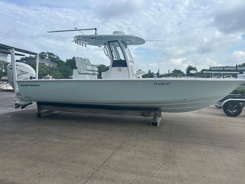 Slide: The Image of 2023 Sportsman Masters 267OE Bay Boat on display at a marina. - 20