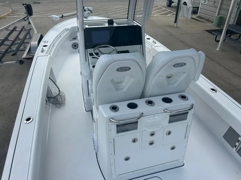 Slide: The Image of 2023 Sportsman Masters 267OE Bay Boat interior with dual seats and control panel. - 25