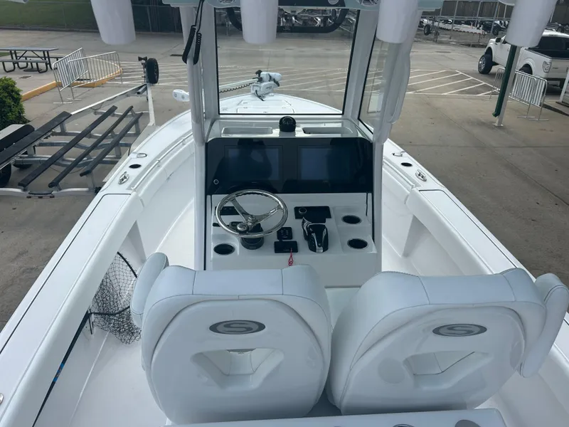 Slide: The Image of 2023 Sportsman Masters 267OE Bay Boat interior with dual seats and modern console. - 28