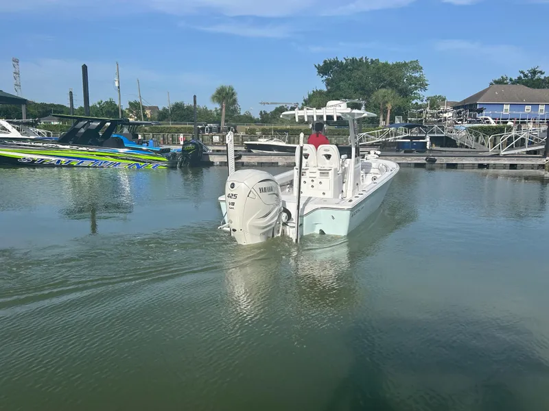 Slide: The Image of 2023 Sportsman Masters 267OE Bay Boat in marina, featuring Yamaha 425 V8 engine. - 3