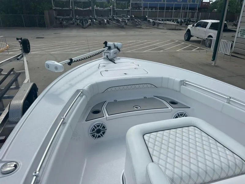 Slide: The Image of 2023 Sportsman Masters 267OE Bay Boat interior with seating and fishing equipment. - 35