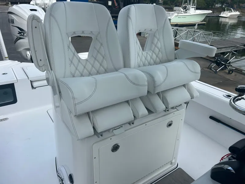 Slide: The Image of 2023 Sportsman Masters 267OE Bay Boat with luxurious white seating and modern design. - 36