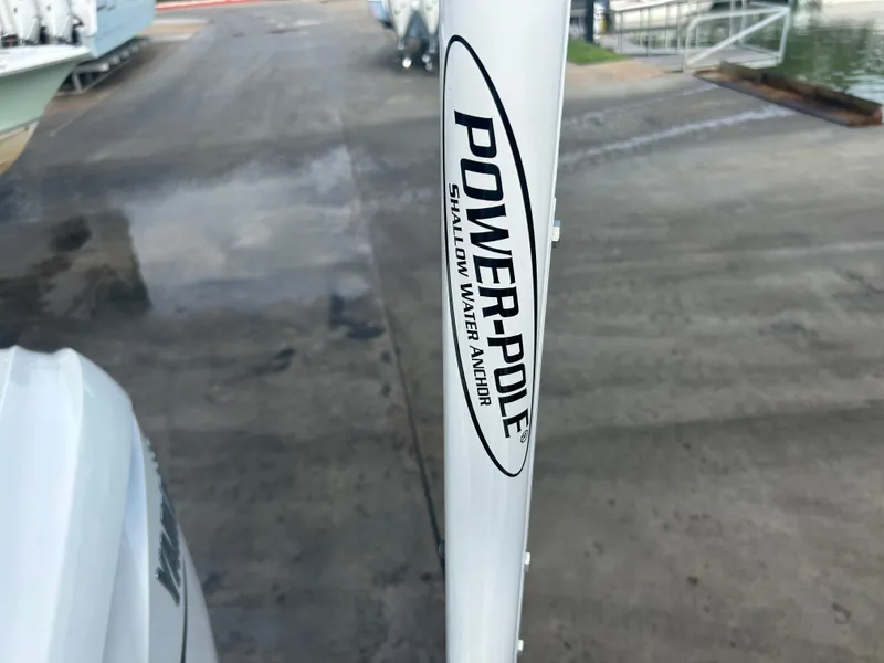 Slide: The Image of Power-Pole shallow water anchor on 2023 Sportsman Masters 267OE Bay Boat. - 45