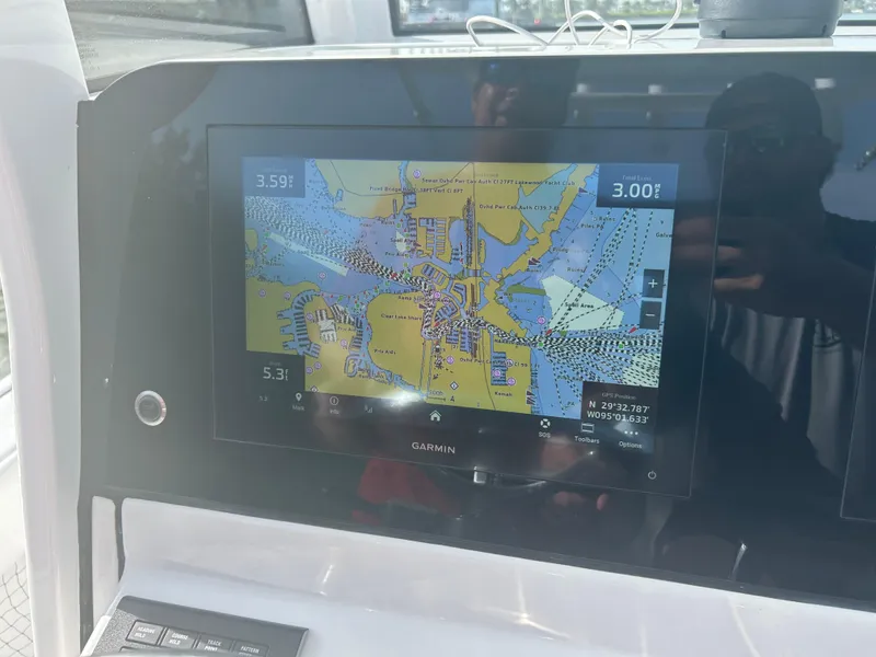Slide: The Image of Garmin navigation display on 2023 Sportsman Masters 267OE Bay Boat showing detailed marine map. - 9