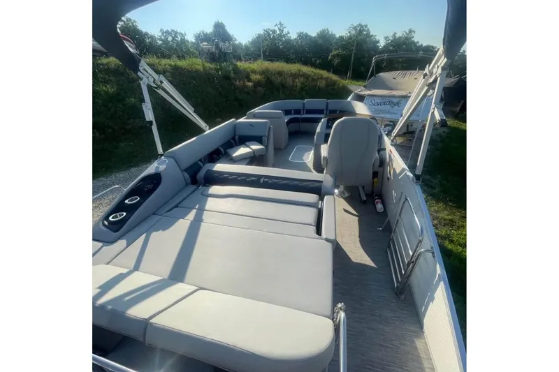 Slide: The Image of 2022 Bennington 23 LSB pontoon boat interior with spacious seating and modern design. - 11