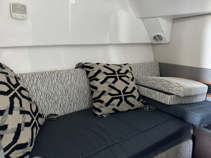 Slide: The Image of Interior of 2019 Everglades 340 Dual Console with patterned cushions and seating. - 4