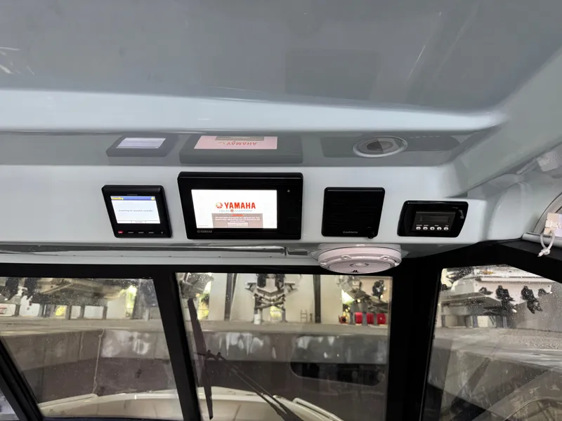 Slide: The Image of Interior dashboard of 2019 Everglades 340 Dual Console boat with Yamaha display. - 7