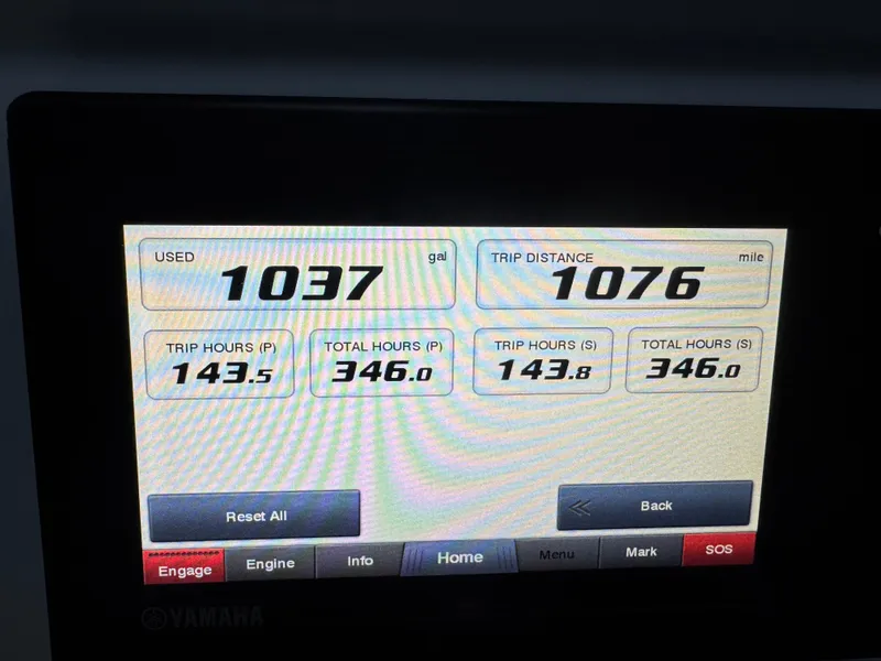 Slide: The Image of Display screen showing Everglades 340 Dual Console trip data: 1037 gallons used, 1076 miles traveled. - 8