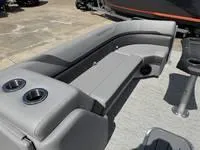 Slide: The Image of 2025 Bennington 25 SXSR boat interior with gray seating and cup holders. - 10