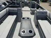 Slide: The Image of 2025 Bennington 25 SXSR boat interior with spacious seating and cup holders. - 11