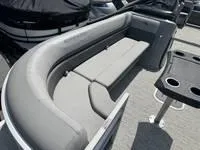 Slide: The Image of 2025 Bennington 25 SXSR boat interior with gray seating and cup holders. - 12