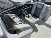 Slide: The Image of 2025 Bennington 25 SXSR boat interior with steering wheel and seating. - 13