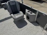 Slide: The Image of 2025 Bennington 25 SXSR boat interior with gray seating and cup holders. - 14
