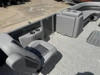 Slide: The Image of 2025 Bennington 25 SXSR boat interior with gray seating and cup holders. - 17