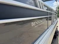 Slide: The Image of 2025 Bennington 25 SXSR pontoon boat, sleek design, side view. - 3