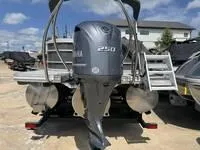 Slide: The Image of 2025 Bennington 25 SXSR pontoon boat with Yamaha 250 engine, rear view. - 5