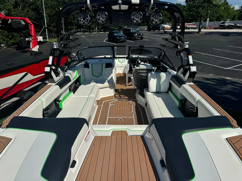 Slide: The Image of 2017 Nautique Super Air Nautique G25 boat interior with seating and sound system. - 6