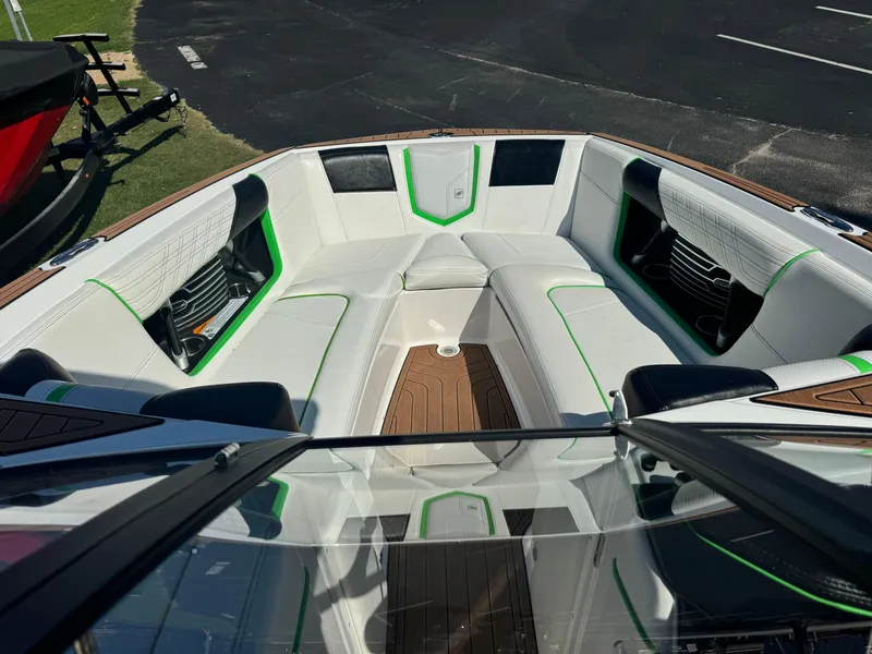 Slide: The Image of 2017 Nautique Super Air Nautique G25 boat interior with white and green seating. - 9