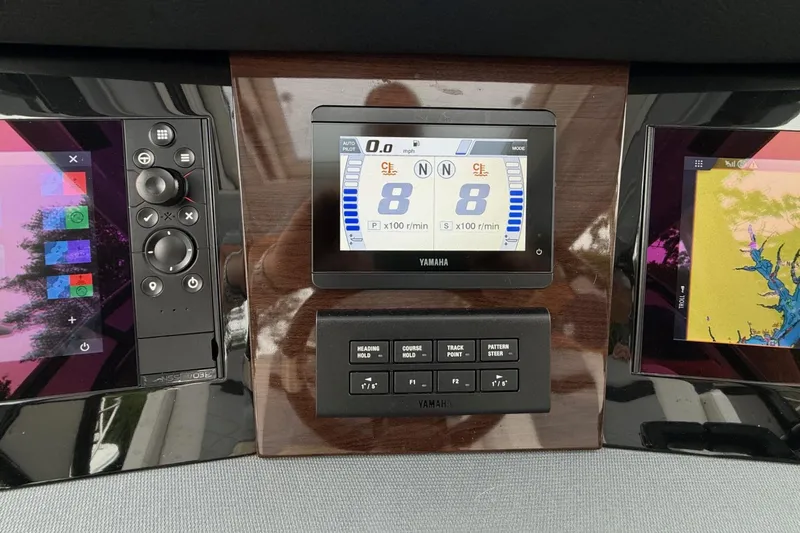Slide: The Image of Dashboard of a 2021 Chaparral 300 OSX boat with Yamaha controls and displays. - 22