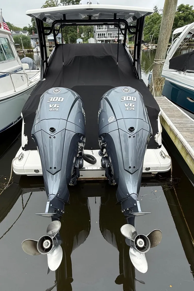 Slide: The Image of 2021 Chaparral 300 OSX boat with twin Yamaha 300 V6 outboard engines docked. - 30