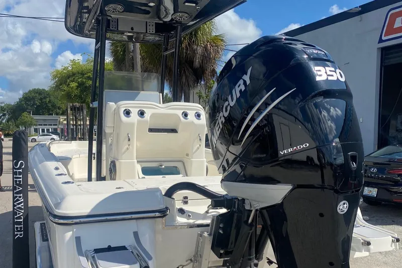 Slide: The Image of 2022 ShearWater 250 Carolina boat with Mercury 350 Verado engine, docked outdoors. - 10