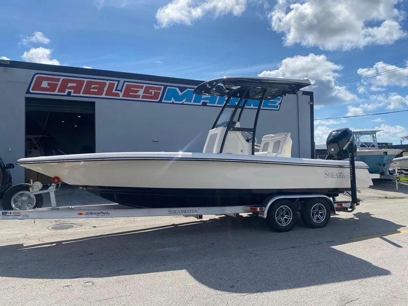 Slide: The Image of 2022 ShearWater 250 Carolina boat on trailer at Gables Marine dealership. - 2
