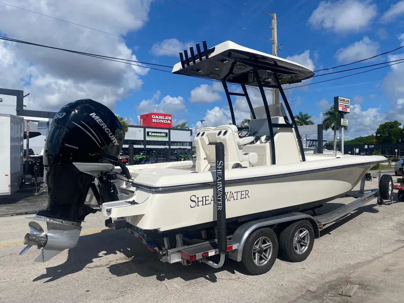 Slide: The Image of 2022 ShearWater 250 Carolina boat with Mercury engine on trailer, outdoor dealership setting. - 3