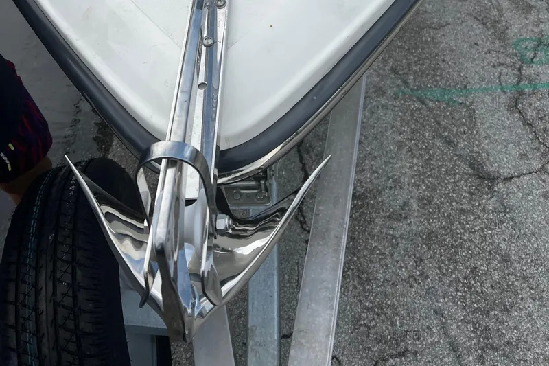 Slide: The Image of Bow of 2022 ShearWater 250 Carolina with shiny anchor on trailer. - 5