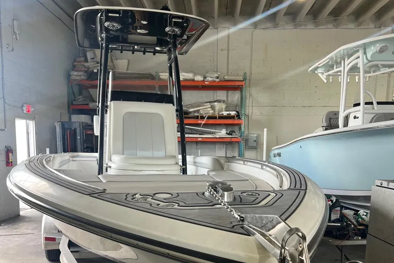 Slide: The Image of 2022 ShearWater 250 Carolina boat in a storage facility, showcasing sleek design and modern features. - 8