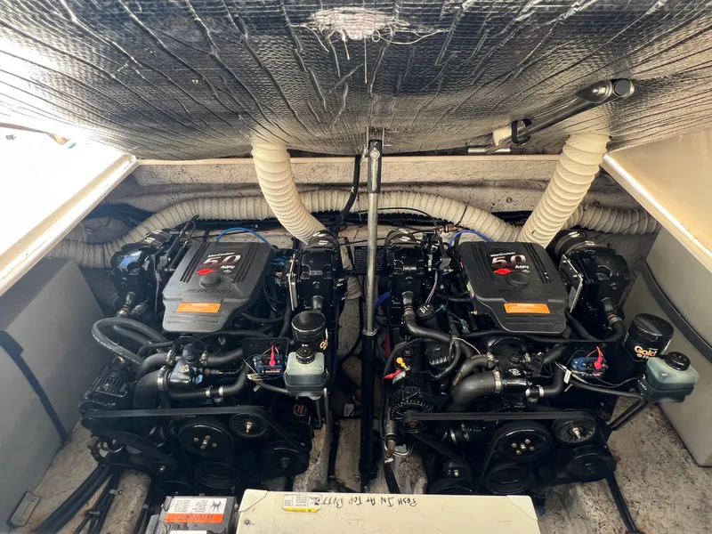 Slide: The Image of Twin MerCruiser engines in a 2003 Rinker 312 Fiesta Vee boat. - 18