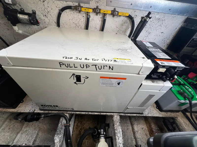 Slide: The Image of Kohler power system in 2003 Rinker 312 Fiesta Vee boat engine room. - 19