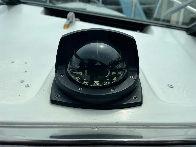 Slide: The Image of Compass on 1986 Tiara Yachts Continental boat dashboard. - 8