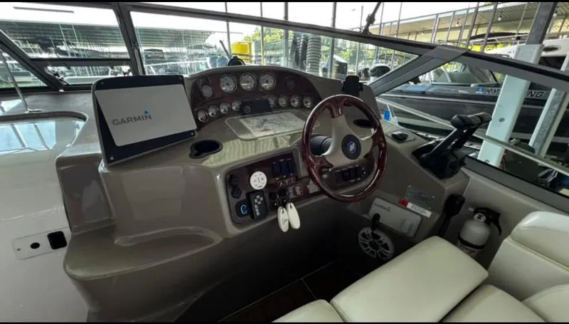 Slide: The Image of 2003 Four Winns 328 Vista boat dashboard with Garmin navigation system. - 11