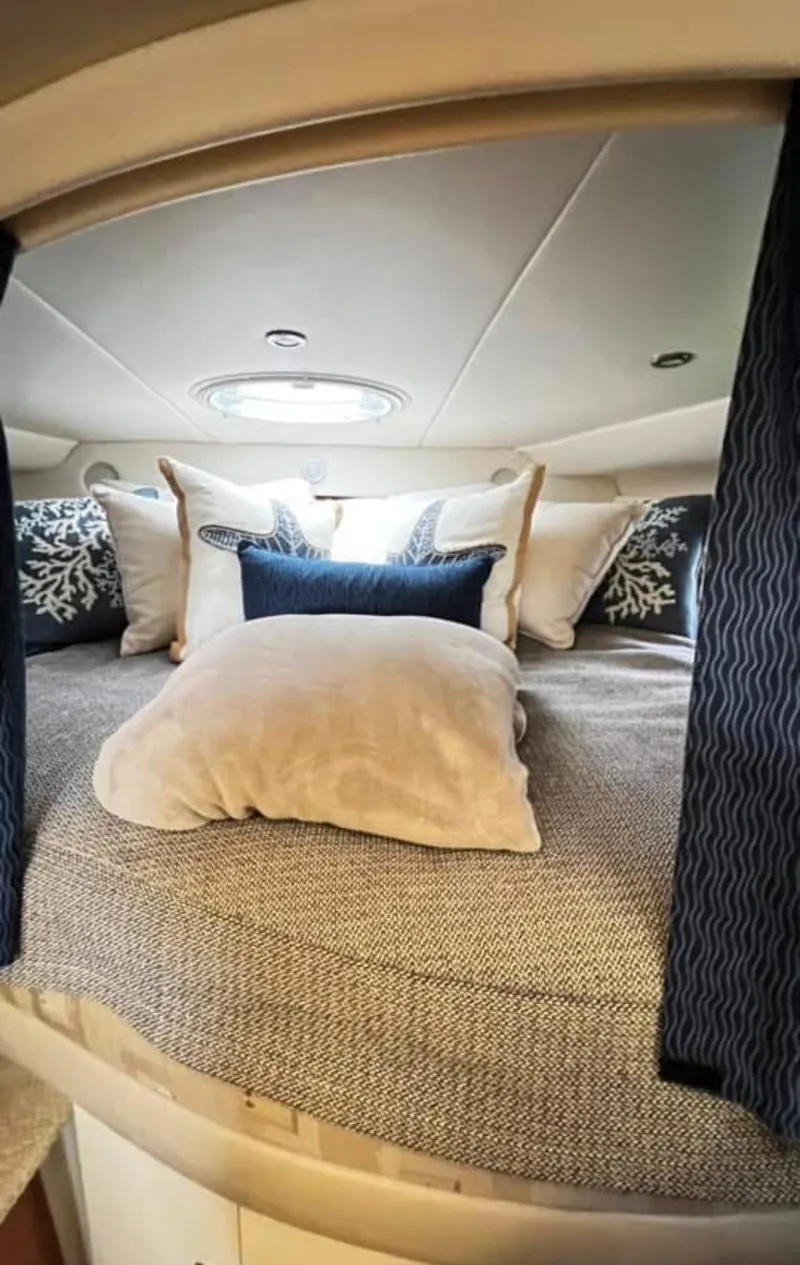Slide: The Image of Cozy cabin interior of 2003 Four Winns 328 Vista with plush bedding and decorative pillows. - 20