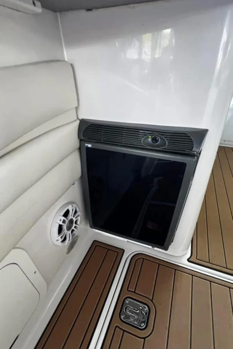 Slide: The Image of 2003 Four Winns 328 Vista interior with speaker and wood flooring. - 9
