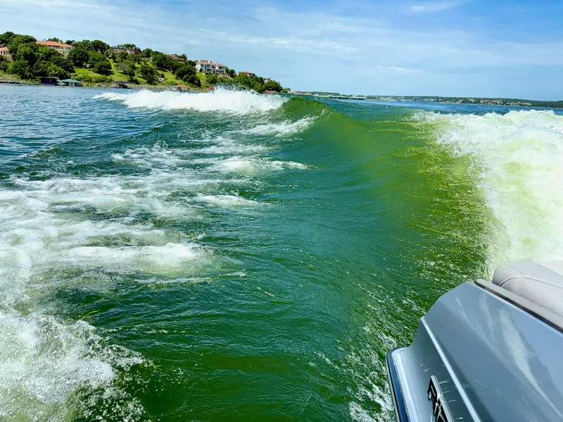 Slide: The Image of 2017 Centurion Ri237 creating waves on a scenic lake. - 10